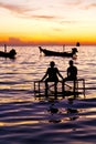 Sunrise people boat and water in thailand coastline south chin