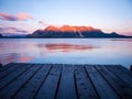 Sunrise at pier with mountains faraway Royalty Free Stock Photo