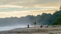 Sunrise at Playa Cocles, beautiful tropical Caribbean beach, Puerto Viejo, Costa Rica east coast, tourists meet the dawn Royalty Free Stock Photo