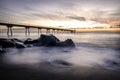 Sunrise on the Pont del petroli beach with silky water.