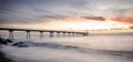 Sunrise on the Pont del petroli beach with silky water.