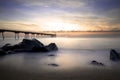 Sunrise on the Pont del petroli beach with silky water.