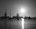 Sunrise in the port with large crane and ships Royalty Free Stock Photo