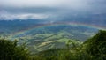 Sunrise with rainbow on a summer day.