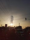 Sunrise at the red light intersection with tower electric