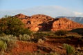 Sunrise on a red rock mountain with a desert landscape