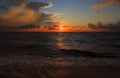 Sunrise reflected in the Ionian Sea, from behind gathering Clouds