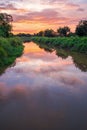 Sunrise reflection in a canal Royalty Free Stock Photo