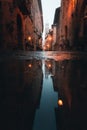 Before sunrise reflection of urban environment. Low angle in medieval old town in Italy Royalty Free Stock Photo