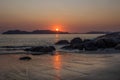 Sunrise with reflections over the beach at Rose Bay