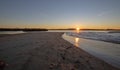 Sunrise reflections over tidal outflow of the Santa Clara river estuary at McGrath State Park of Ventura California USA Royalty Free Stock Photo