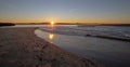 Sunrise reflections over tidal outflow of the Santa Clara river estuary at McGrath State Park of Ventura California USA Royalty Free Stock Photo