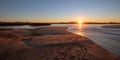 Sunrise reflections over tidal outflow of the Santa Clara river estuary at McGrath State Park of Ventura California USA Royalty Free Stock Photo