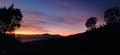 sunrise rising between the hills of Mount Bromo? Royalty Free Stock Photo