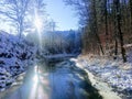 Sunrise river sun Sunrays forest snow landskape Royalty Free Stock Photo