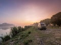 sunrise on the river waking up relaxed in a camper van Royalty Free Stock Photo