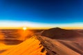 Sunrise in the Sahara desert next to M`hamid in Morocco Royalty Free Stock Photo