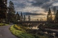 Sunrise on the Sammamish river with a bridge over the river with the paved trail on the left in Redmond Washington