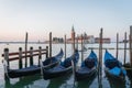Sunrise in San Marco square, with gondolas on the Venice Grand Canal, Venice, Italy Royalty Free Stock Photo