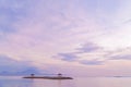 Sunrise on Sanur beach in Bali. An island with gazebos on the beach against the background of the Agung volcano . Royalty Free Stock Photo