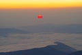 Sunrise scene with red sun over the mountains