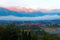 Sunrise scenery of majestic Hakuba Mountain Range with golden glow on the submit