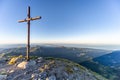 Cross at sunrise on the summit of Mountain peak of mount Pania on the Apuan Alps Alpi Apuane, Tuscany, Lucca