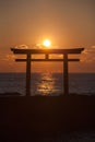 Sunrise and sea at Japanese shinto gate Royalty Free Stock Photo