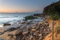 Sunrise seascape with beach erosion
