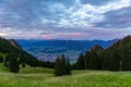 sunrise seen from mountain peak of Gruenten with village of Rettenberg and Alps panorama