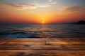 Sunrise serenity Wooden table with a backdrop of a stunning, blurred sea sunrise