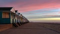 Sunrise shining on colourful beach huts in Southwold, Suffolk, England Royalty Free Stock Photo