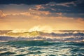 Sunrise and shining waves in ocean Royalty Free Stock Photo