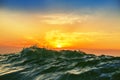 Sunrise and shining waves in ocean Royalty Free Stock Photo