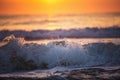 Sunrise and shining waves in ocean Royalty Free Stock Photo