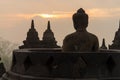 Sunrise silhouette buddha sculpture in open stupa Royalty Free Stock Photo