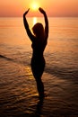 Sunrise silhouette of a woman