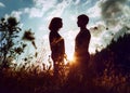 Sunrise silouettes of two inlove young people Royalty Free Stock Photo