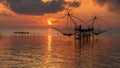 Sunrise sky with fisherman on square dip net and tourism boat at Pakpra village Royalty Free Stock Photo