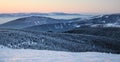 Sunrise in snow covered Jeseniky mountains in Czechia during nice winter with fog and clear sky. Wiew of Czech mountains, trees an