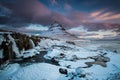 The sunrise at snowy Kirkjufell hill