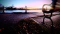 Sunrise Solitude at the Pier's Tranquil Park Bench Royalty Free Stock Photo