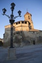 Sunrise in square on May 1, with side front and source of the church of San pablo and lamppost, Ubeda
