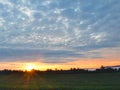 Sunrise star glow morning over crop fields in FingerLakes Royalty Free Stock Photo