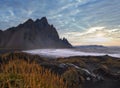 Sunrise Stokksnes cape sea beach and Vestrahorn Mountain, Iceland. Amazing nature scenery, popular travel destination. Autumn