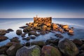 Sunrise summer landscape with old broken pier