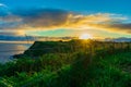 Sunrise sun over the green hills by Atlantic Ocean. Basque country, Spain. Way of St. James, El Camino de Santiago Royalty Free Stock Photo