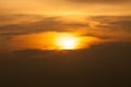 Sunrise-Sunset with clouds, light rays and other atmospheric effect.Brilliant orange sunrise over clouds with bright yellow sun Royalty Free Stock Photo