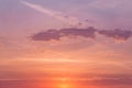 Sunrise  sunset pink violet orange blue sky with sun and sunlight  cirrus clouds background texture Royalty Free Stock Photo