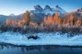 Sunrise of the Three Sisters and the Bow River from Canmore near Banff National Park. First snow in Canadian Rockies.